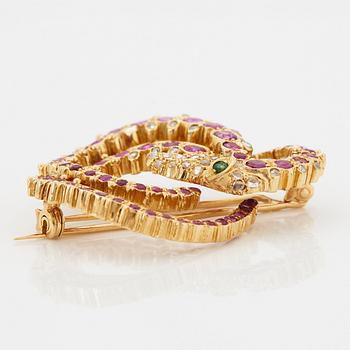 Ilias Lalaounis brosch 18K guld med fasettslipade rubiner, en smaragd och rosenslipade diamanter.