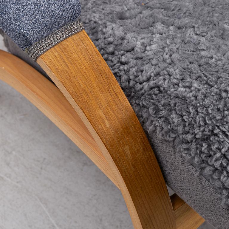 A 'Delta Adventure' armchair with ottoman, Brunstad, Norway.