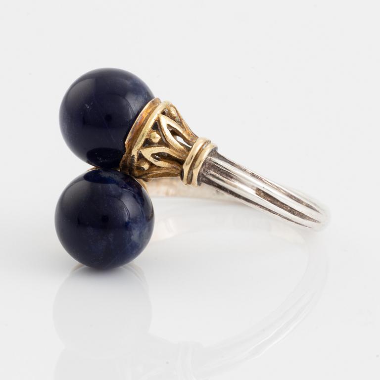 An Ilias Lalaounis ring in silver and 18K gold with sodalite.