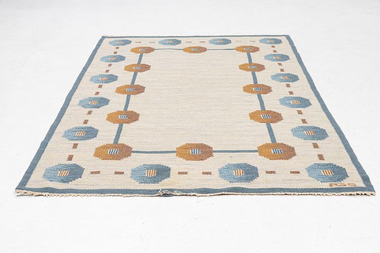 A flat weave carpet by Anna-Greta Sjöqvist c 223 x 144 cm, signed AGS.
