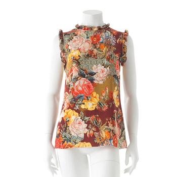 719. DOLCE & GABBANA, a floralpatterned blendmaterial top.