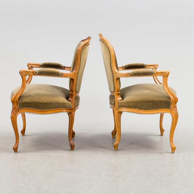 A pair of mid 20th century rococo style armchairs.