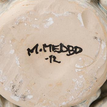 A stoneware sculpture signed M. Medbo -12.