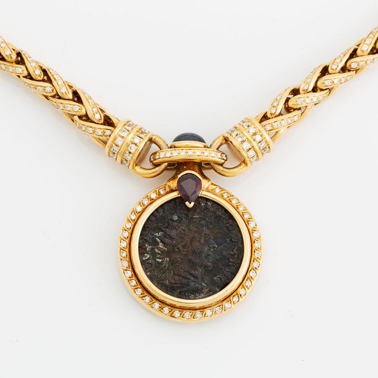 An 18K gold and ancient coin necklace set with a sapphire, a ruby and round brilliant-cut diamonds.