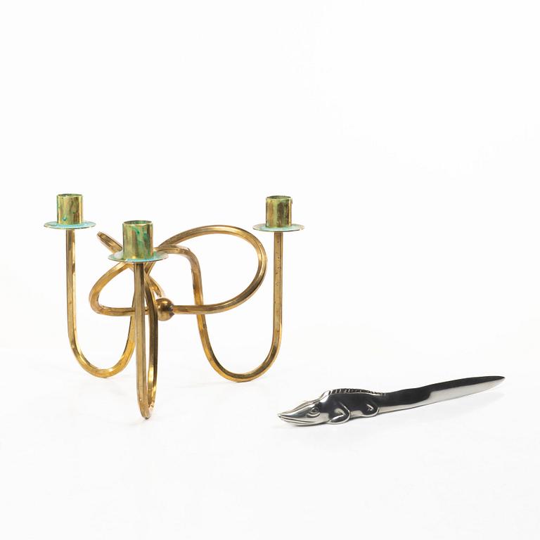 Firma Svenskt Tenn, Candelabrum, 'Vänskapsknuten', and paper knife, 'Alligator'.