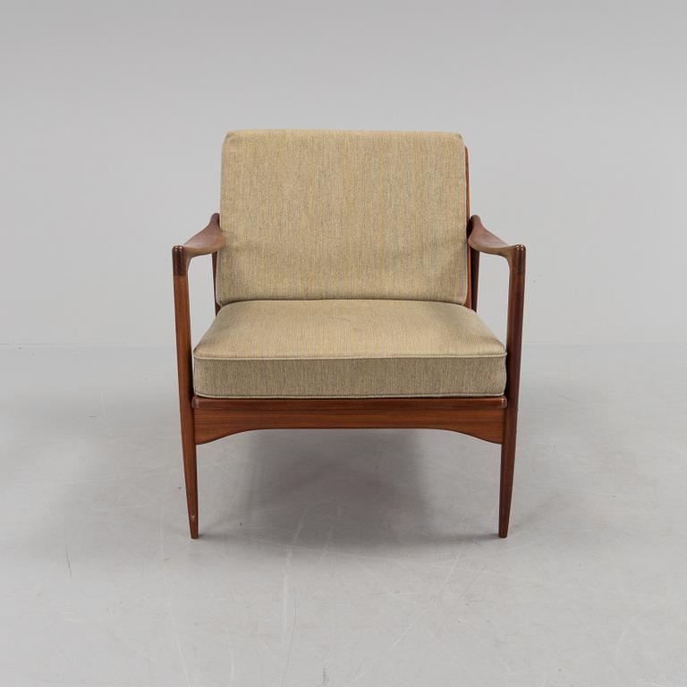a 1960s teak "Kandidaten" armchair designed by IB Kofod Larsen for OPE Möbler, Jönköping.