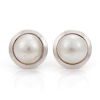 A pair of cultured mabé pearl earrings.