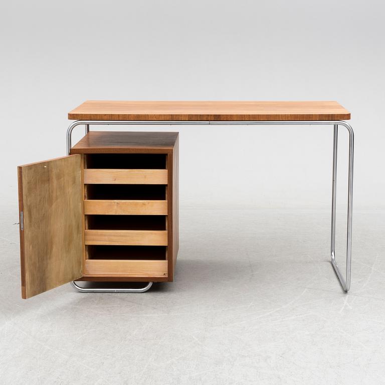 A walnut and tubular steel table, 1930's.