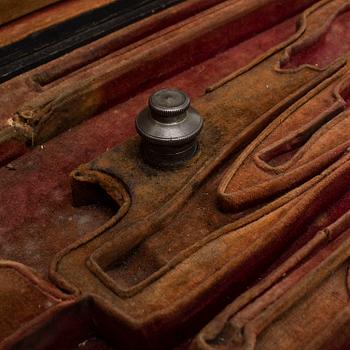 A pair of mid 19th century percussion pistols in a case marked Campagnac a Bordeaux.