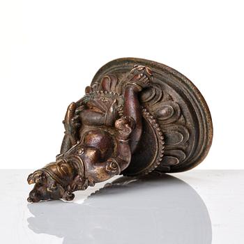 A copper alloy figure of Jambhala, Nepal, possibly 12/13th Century.
