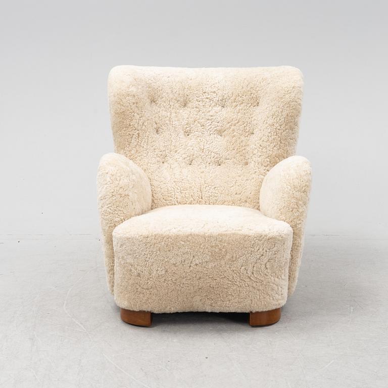 A lounge chair with new sheepskin upholstery, Denmark, 1940's.
