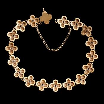 ARMBAND, 18K tvåfärgat guld, RNS, briljantslipade diamanter tot ca 0.50 ct. Vikt ca 27,4 g.