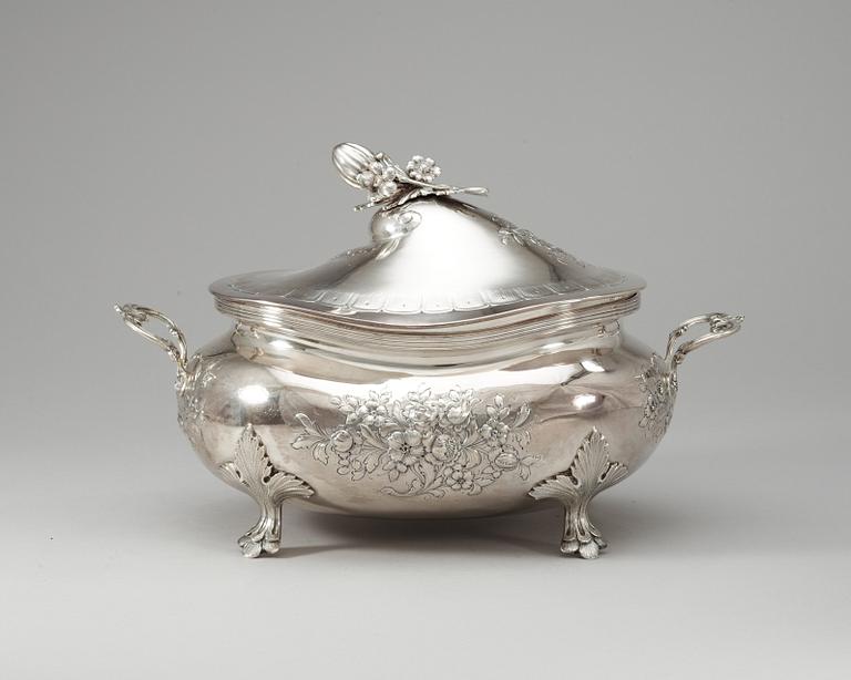 A Roccoco style sterling tureen with cover.