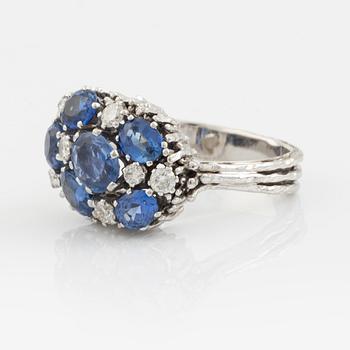 A WA Bolin ring in 18K white gold set with sapphires and round brilliant-cut diamonds.