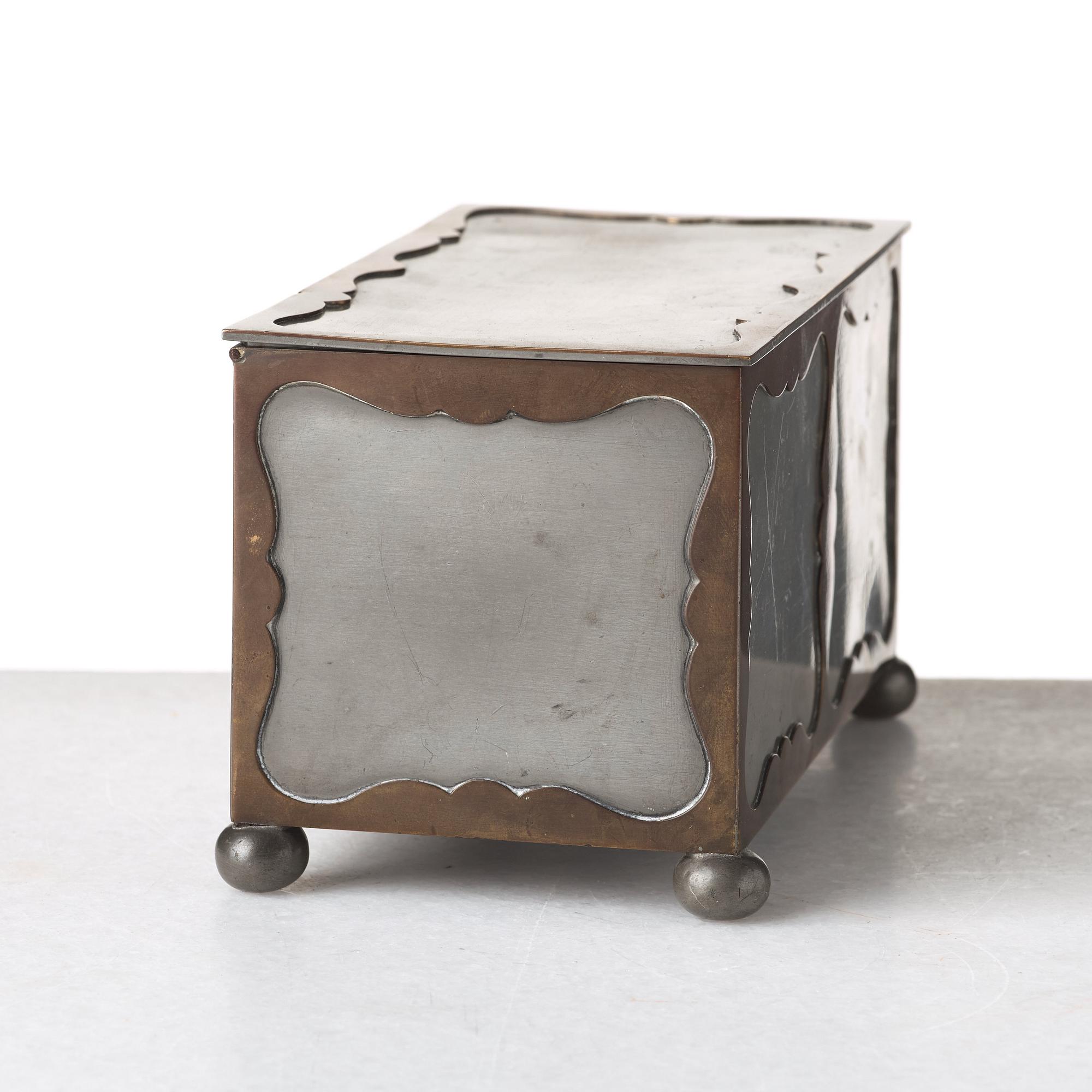 Firma Svenskt Tenn, a pewter and brass box, Stockholm 1930, model A 854.