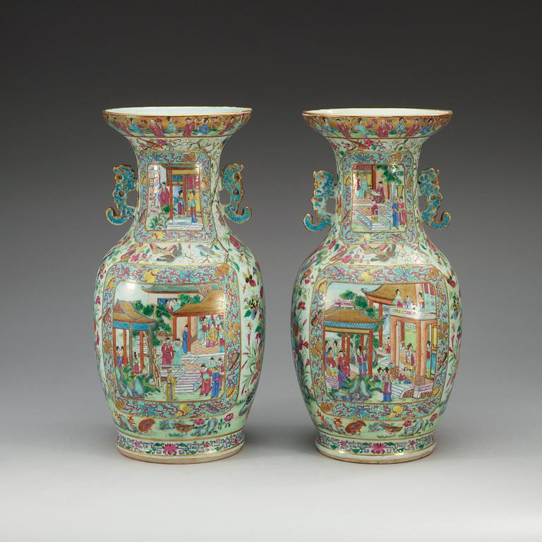 A pair of famille rose Canton vases, Qing dynasty, 19th Century.