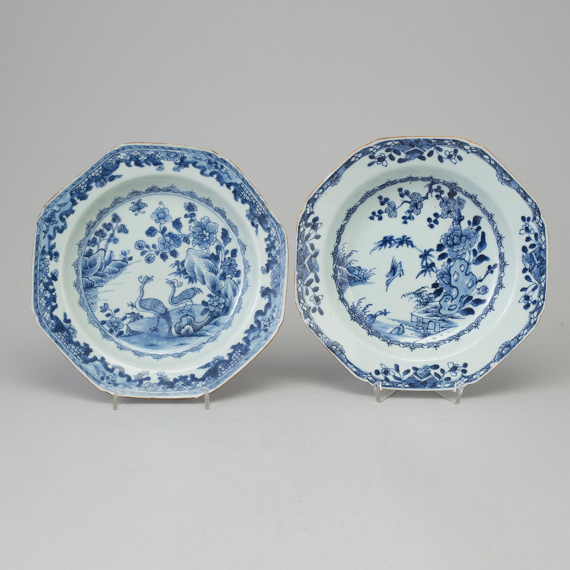 Two blue and white dishes and two cups with dishes, Qing dynasty, Qianlong (1736-95) and Kangxi (1662-1722).