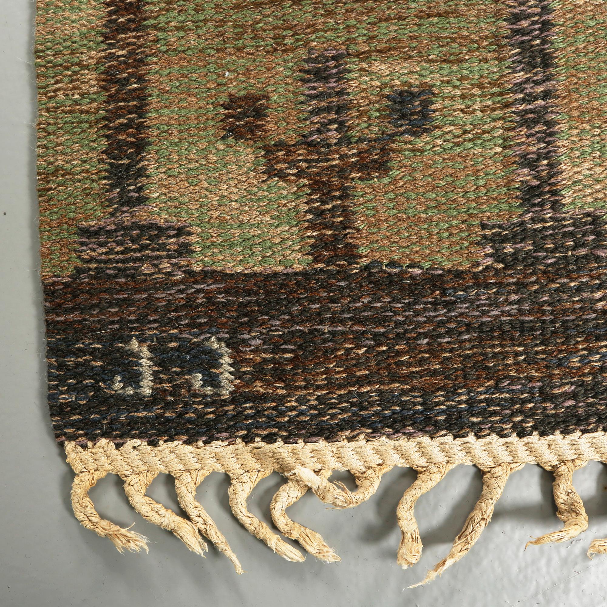 A flat weave by Judith Johansson, signed JJ, second half of the 20th century, 326 x 248 cm.