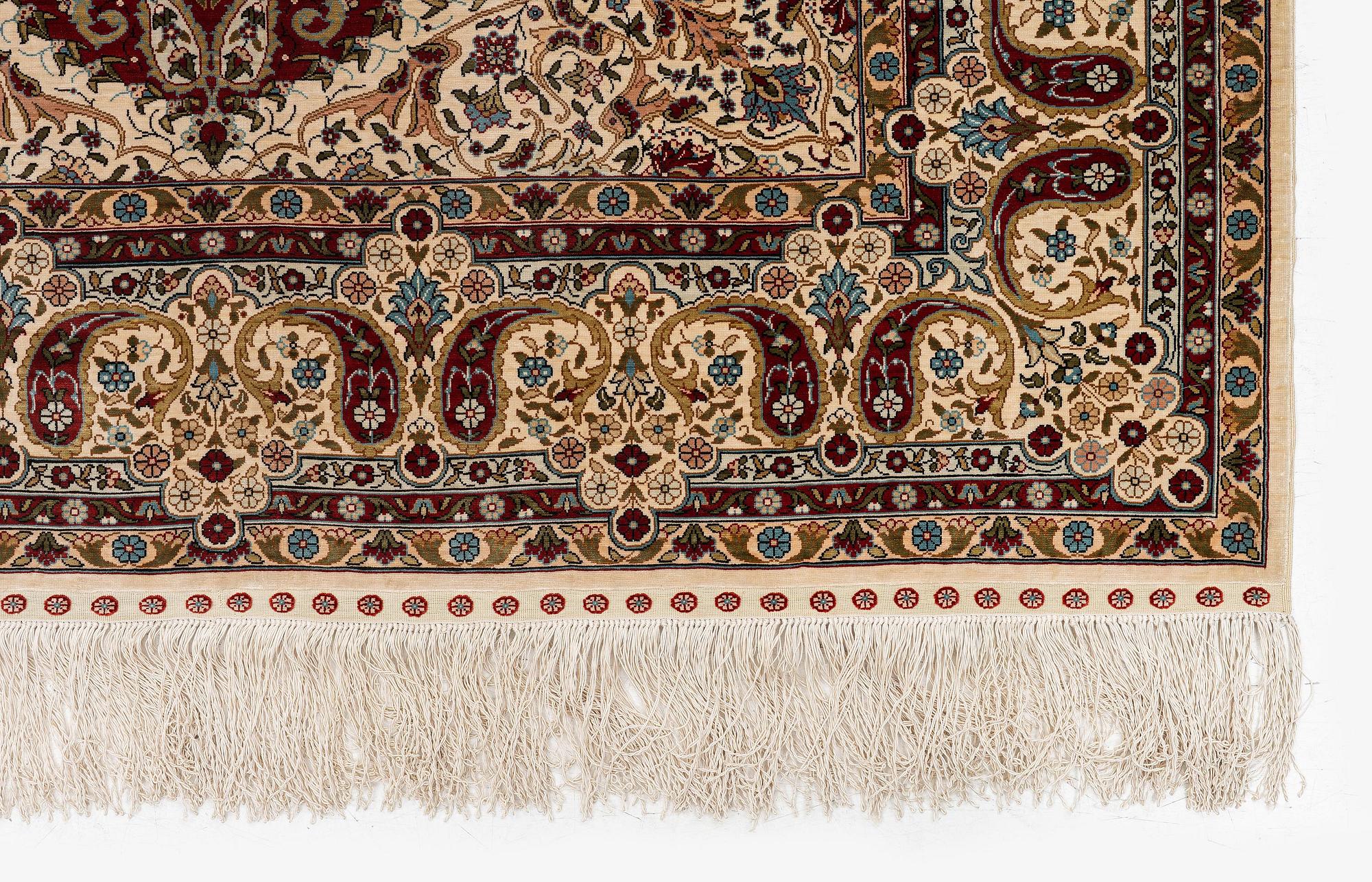 A semi-antique silk Hereke rug, West Anatolia, c. 180 x 121 cm.