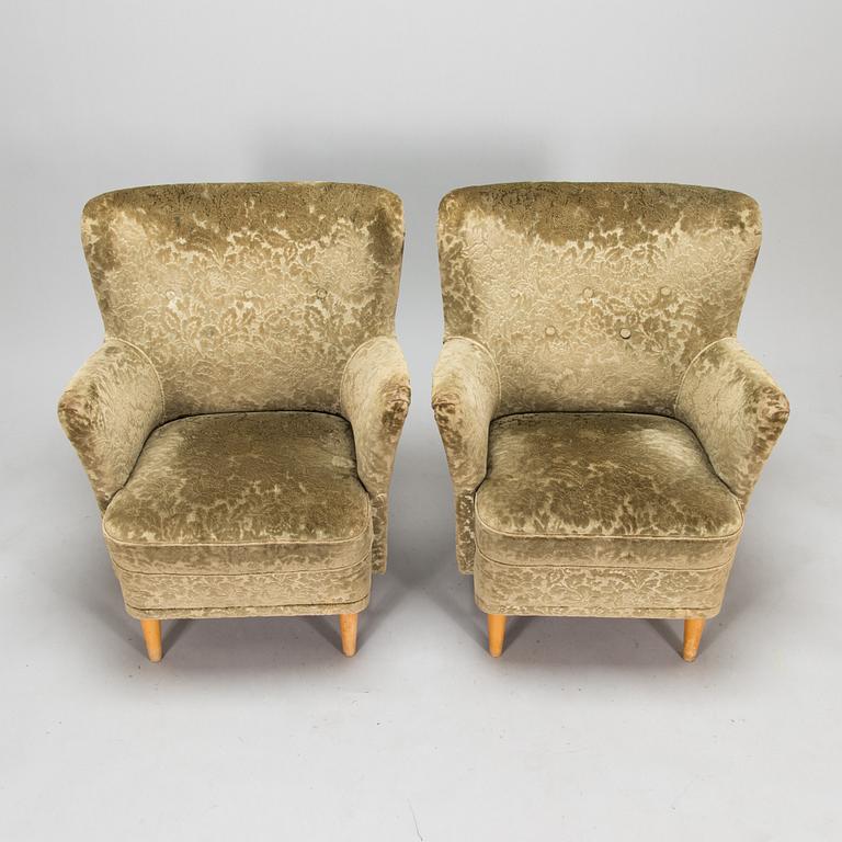 A pair of 1950s armchairs.