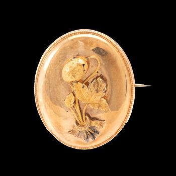 A 14K gold brooch.