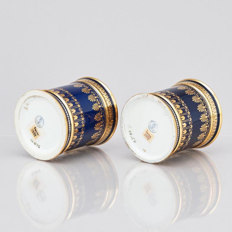 A pair of Sèvres cups with stands, 19th Century.