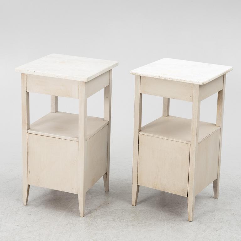 A matched pair of bedside tables.