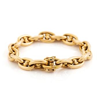 An 18K gold bracelet.