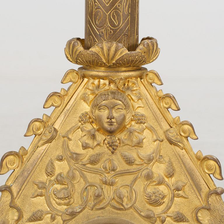 Two similar 19th century bronze candelabras.