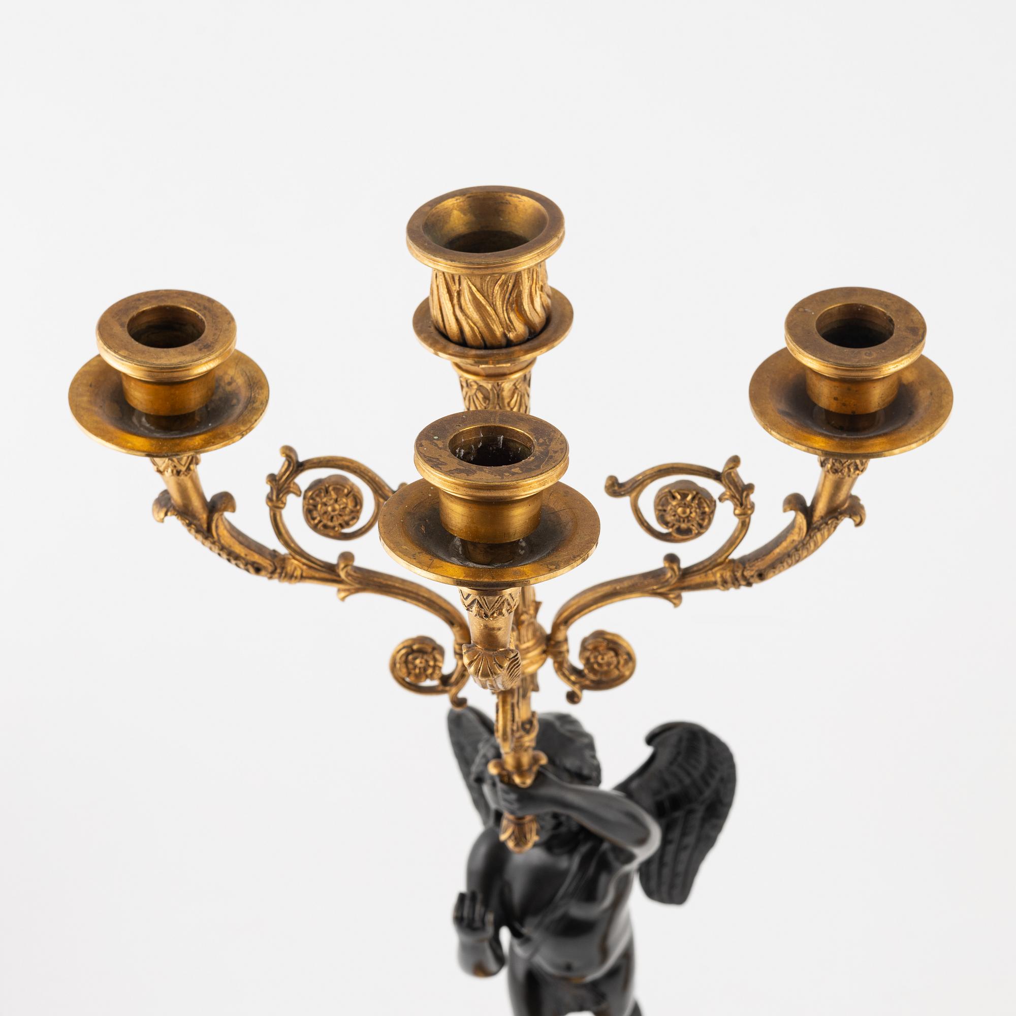 A pair of Empire-style ormolu and marble four-light candelabra, late 19th century.