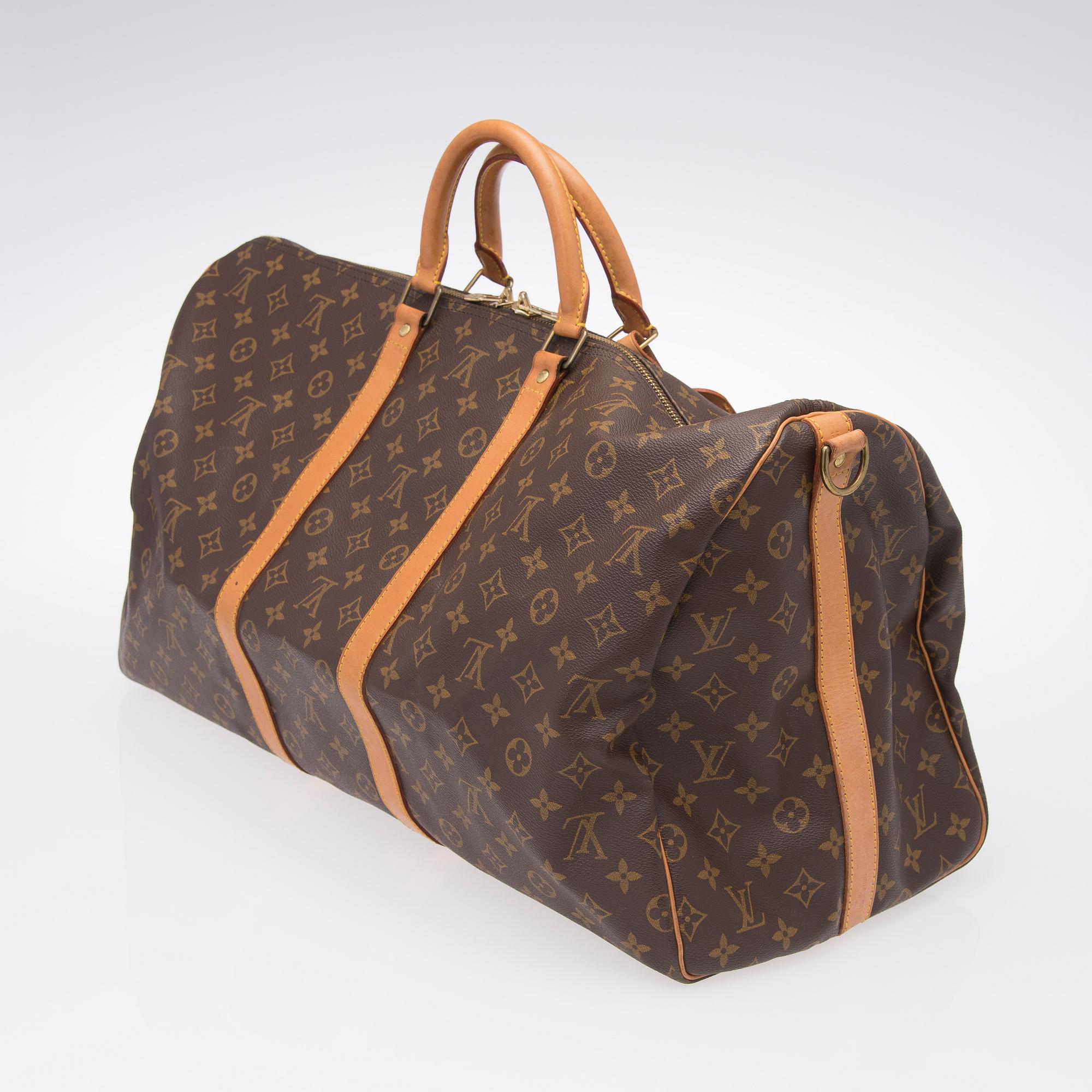 A Keepall Bandouliere 55 WEEKEND BAG by Louis Vuitton.