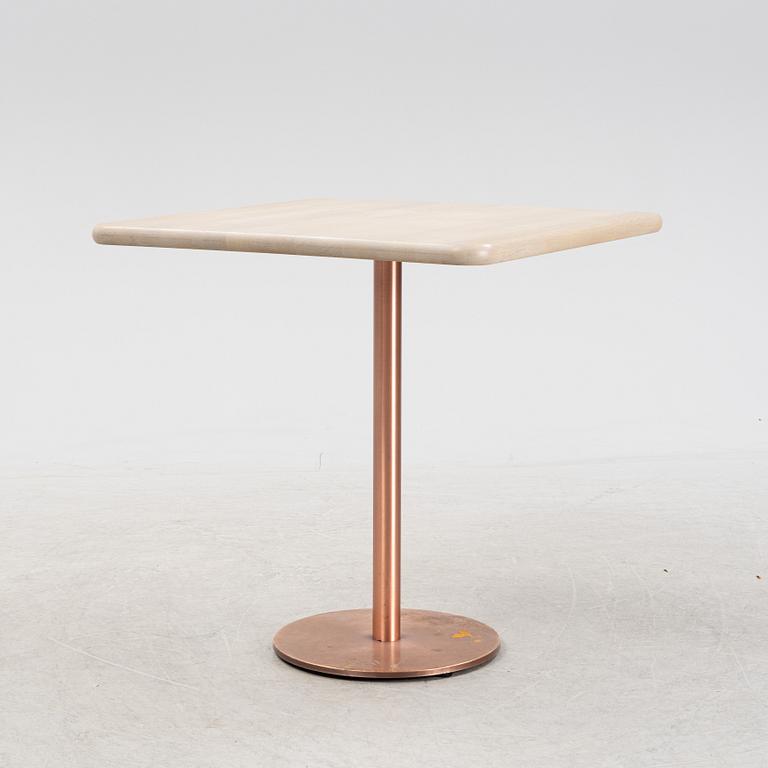 A steel and oak table by Jonas Lindvall 2011.