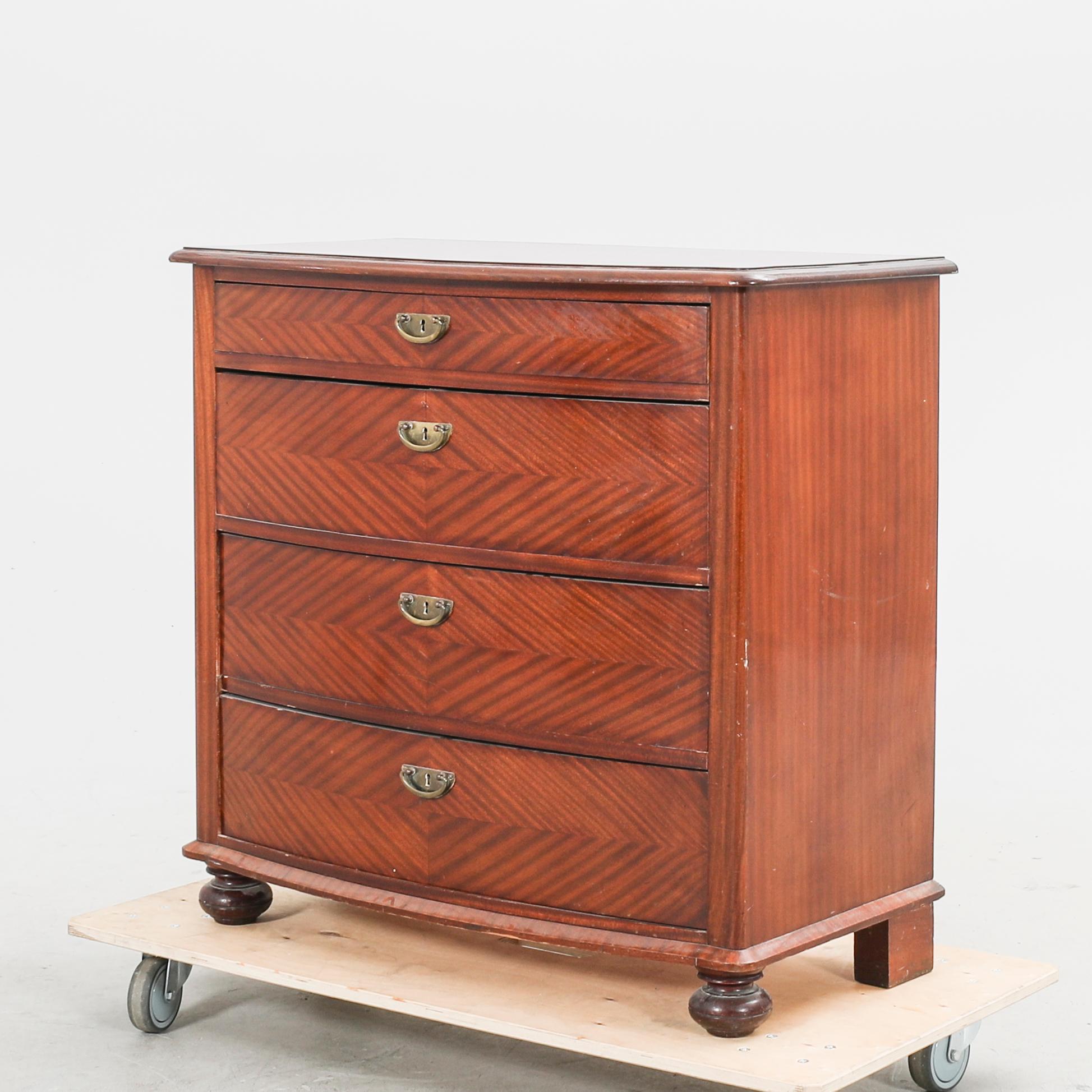 An early 1900s mahogany dresser.