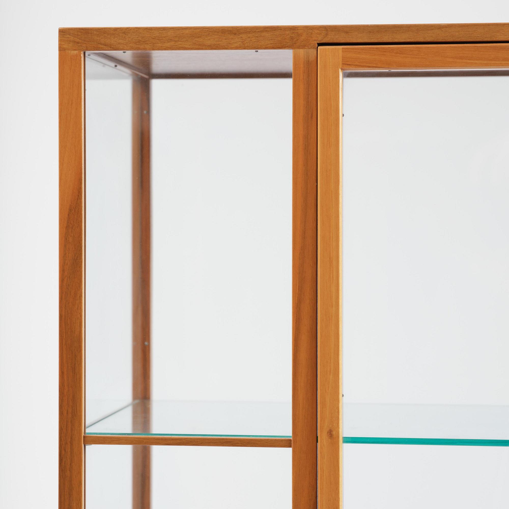 Josef Frank, a walnut showcase cabinet model "B 2077", Firma Svenskt Tenn.