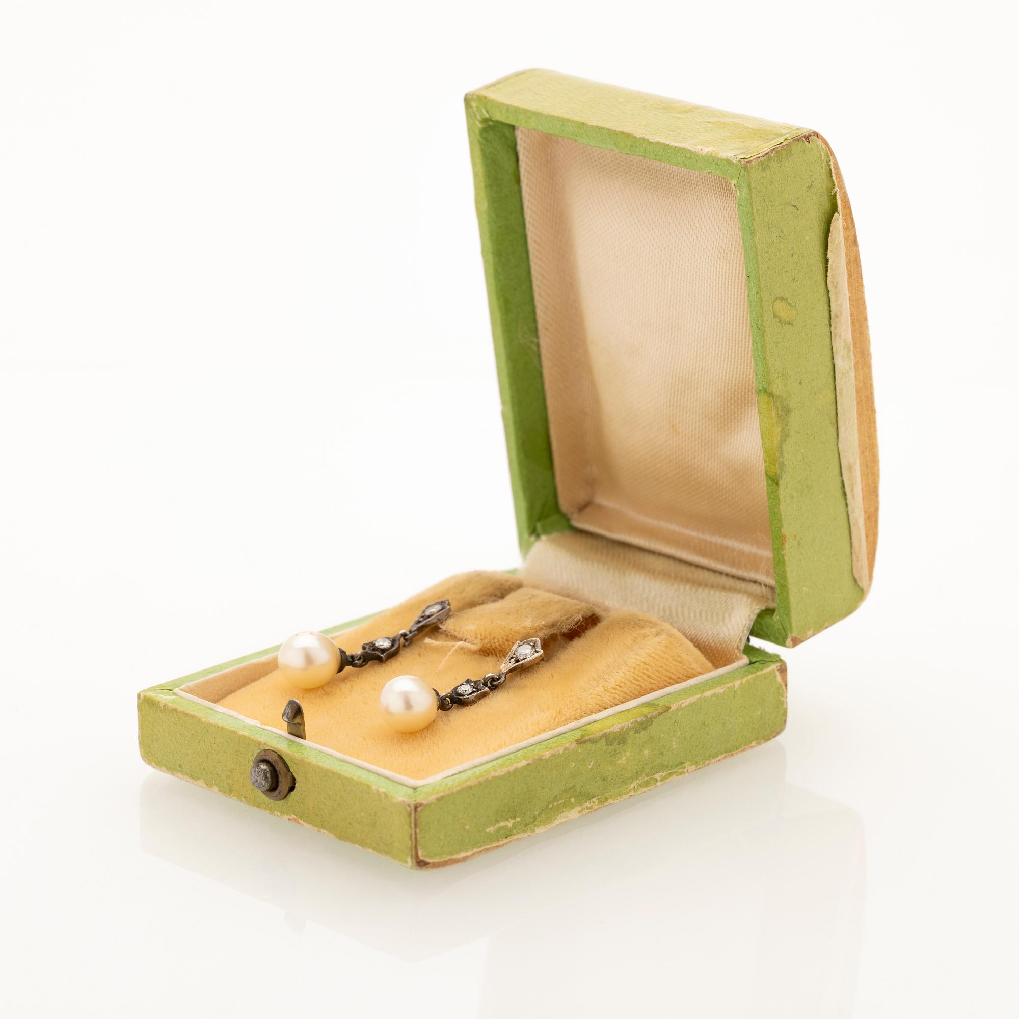 Earrings, a pair, 18K gold and silver with diamonds and cultured pearls.