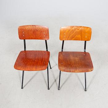 A pair of Friso Kramer Industrial 1950s chairs.