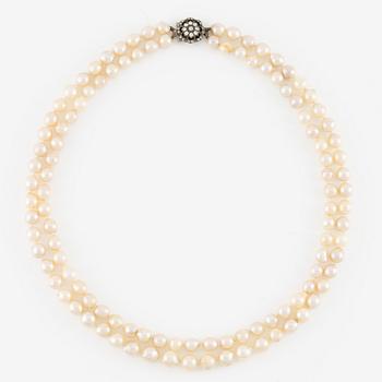 Pearl necklace, double-stranded with cultured pearls, with a clasp of silver set with pastes.