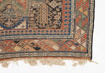 An oriental carpet, c 280 x 130 cm.