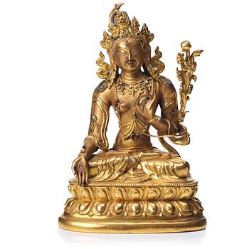 695. A gilt bronze figure of a White Tara, Tibetan-Chinese, 18th Century.