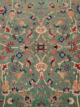 A carpet, a semi-antique Tabriz, ca 374-376,5 x 268-276 cm.