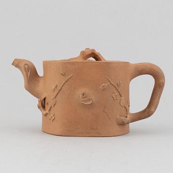 A Yixing pottery tea pot with cover, China, 20th Century, with seal mark.