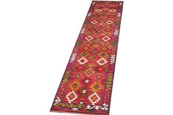 A Kilim runner carpet, c. 489 x 80 cm.