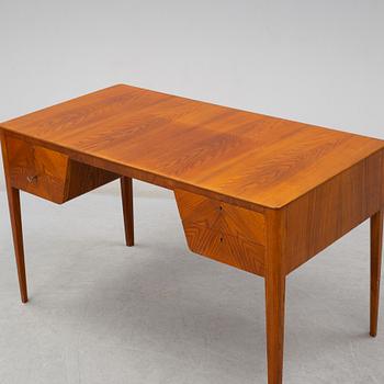 A mid 20th century elm veneered desk.