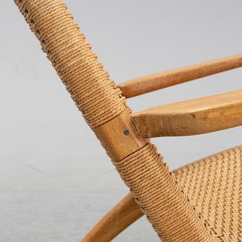 A 'CH-25' armchair designed by Hans J Wegner for Carl Hansen & Søn, Denmark.