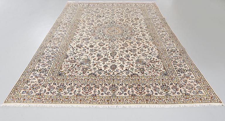 A Keshan rug, 340 x 236 cm.
