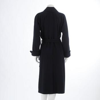 CÉLINE, a dark blue cashmere and wool coat.