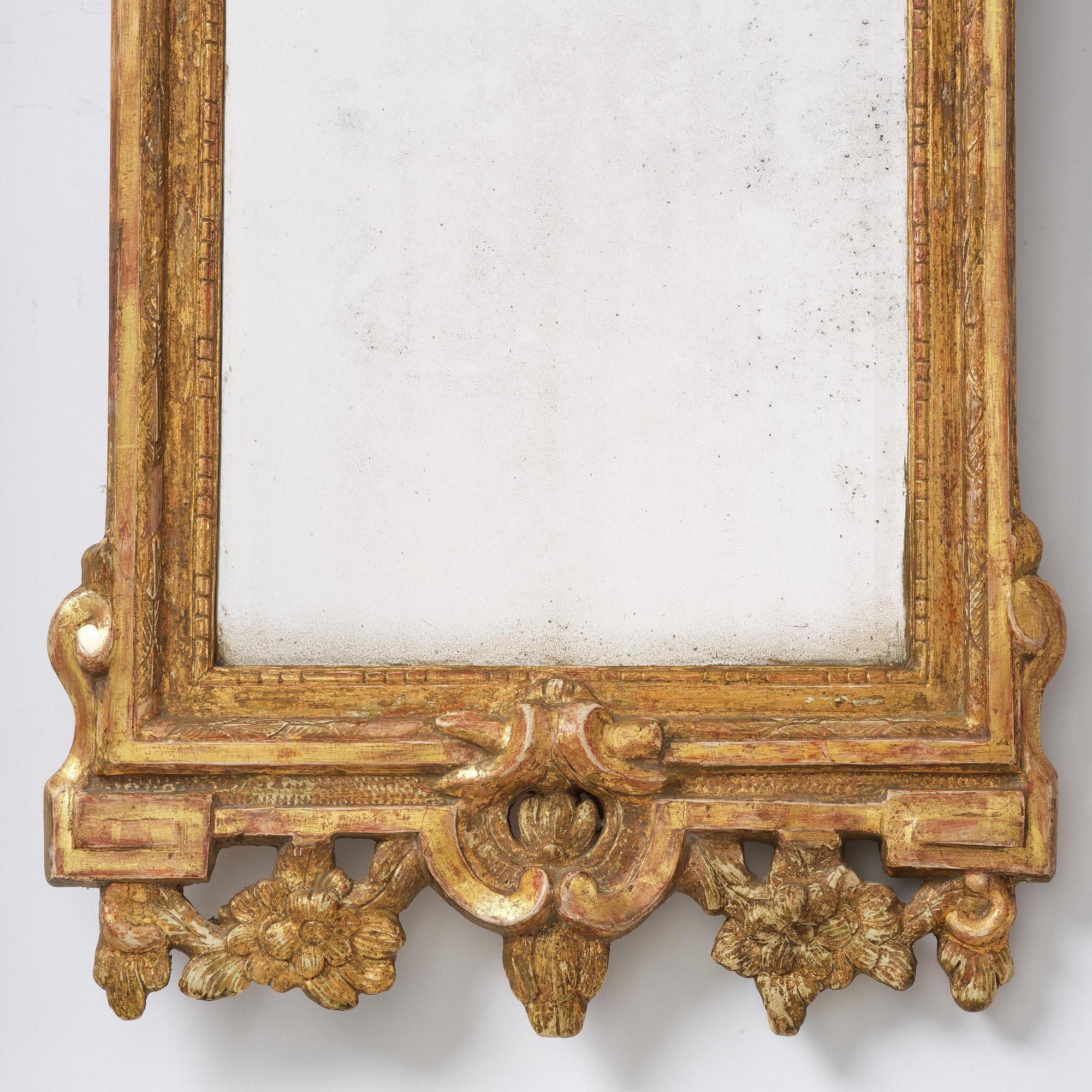 A Swedish rococo giltwood mirror, Stockholm, later part 18th century.
