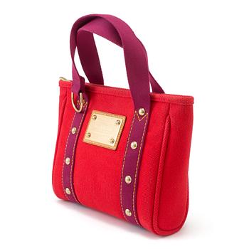 Handbag by Louis Vuitton.
