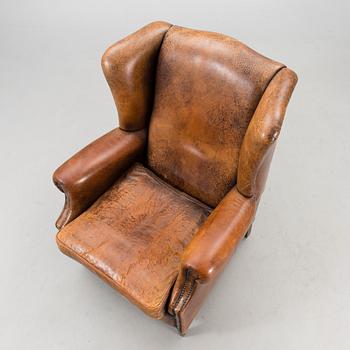 A Chesterfield style armchair from the latter part of the 20th century.