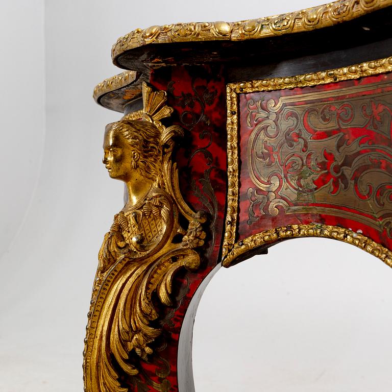 A Boulle style table around 1900.